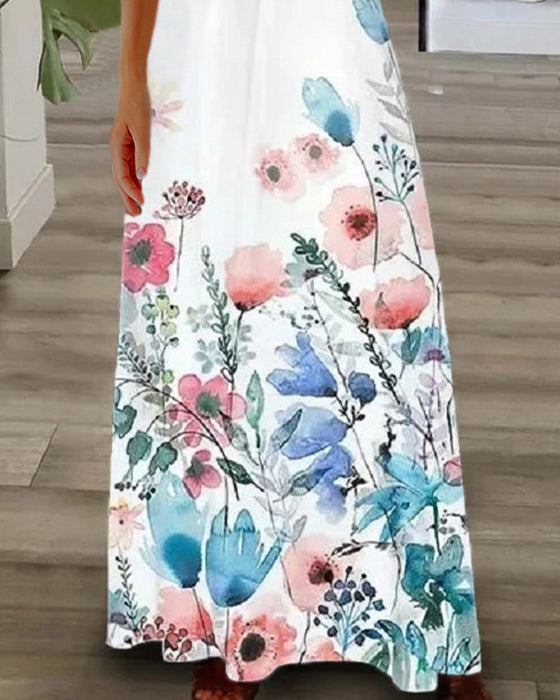 Blommig maxiklänning med spetsärmar