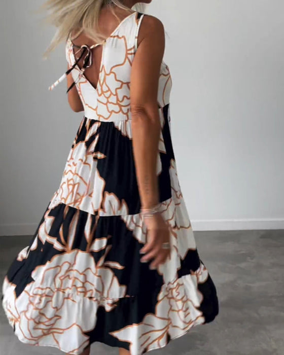 Klänning med ärmar och blommönster