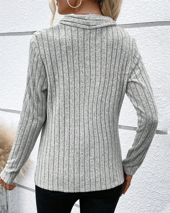 V-ringad crossover stickad topp