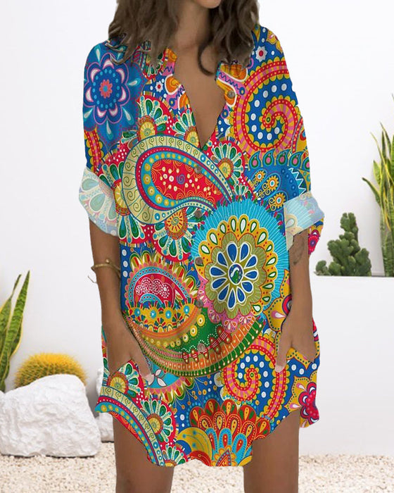 Klänning med knapptryck med lång ärm och ficka