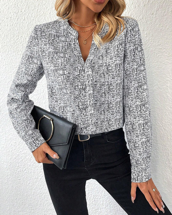 V-ringad elegant långärmad blus med tryck