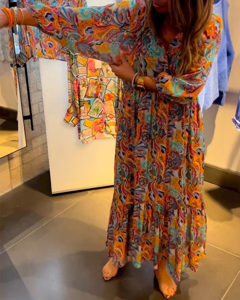 Lång klänning med A-linjetryck och V-ringning