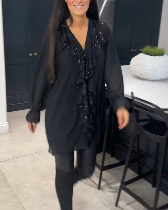 Blus med volanger och elegant stil