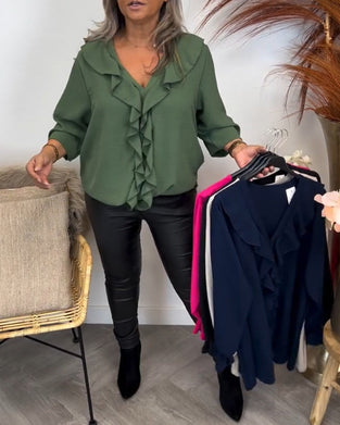 Ensfarget elegant topp med volang